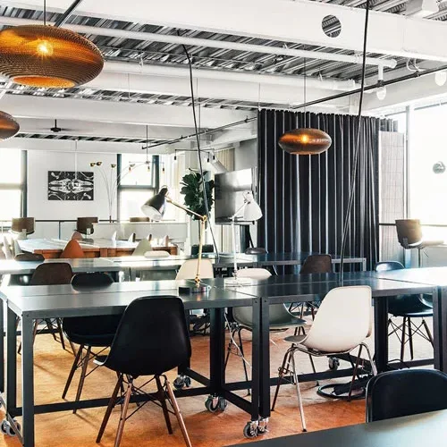 Clean coworking space with shared tables